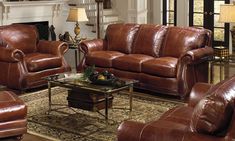 a living room filled with lots of brown furniture