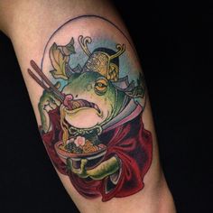 a tattoo with a frog holding a bowl and chopsticks