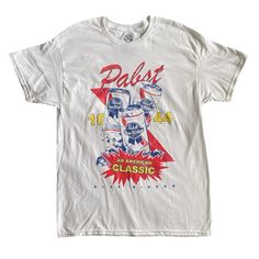 Color: White Front Graphic Tee: Pabst Blue Ribbon 1844 An American Classic With Three Pabst Beer Cans (Bold Colors: Red, Blue, Yellow) Made To Look Distressed / Vintage Women’s Size Large / Unisex Approximate Flat Lay Measurements: Chest/Pit To Pit 22” Length 31.5” Brand New, Never Worn, Tag Removed, Plastic Tag Fastener Attached. Note Crooked Stitching On Bottom Hem, Barely Noticeable, But See Close-Up Picture. Vintage | Beer | Brewing | Classic | Pbr | American |