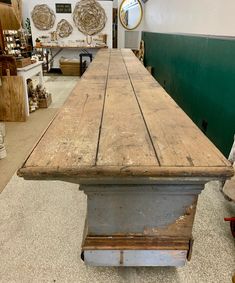 an old wooden table in a store