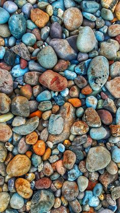 many different colored rocks are arranged together on the ground, and there is no image here to provide a caption for