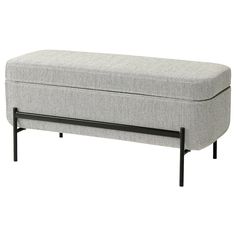 a grey bench with black legs and a foot rest on the bottom one end is upholstered