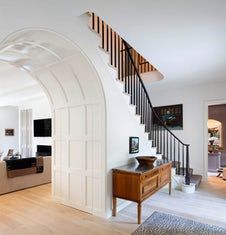 an image of a living room with stairs and furniture in the background, on instagram