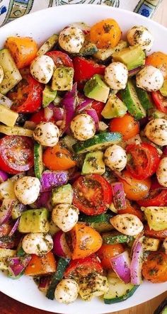 a white plate topped with lots of veggies