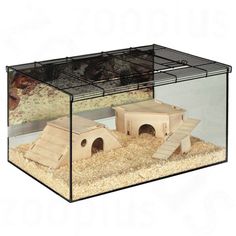 an animal cage with sand and gravel inside