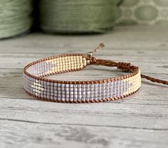 a close up of a bracelet on a table