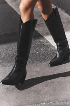 Knee high boots made of leather. Cowboy style. Side pull tabs. Pointed toe. Heel height: 2 inches (5 cm) Carefree Fashion, Black Western Boots, Fashion Cowboy Boots, Black Cowgirl, Black Cowboy Boots, Black High Boots, Entrepreneur Fashion, Skirts Outfits, Black Boots Tall