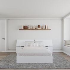 a bedroom with white walls and flooring has a large bed in the center, along with shelves above it