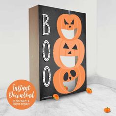 an orange and black halloween treat bag with pumpkins on it