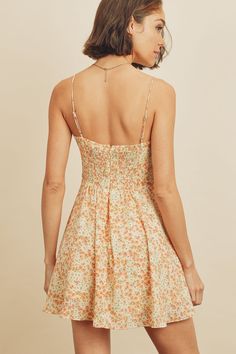 Another fun and flirty sundress to add to your summer wardrobe, our flare fitting Lily Floral cami mini dress is a sweet and soft style that's an absolute must for some outdoor summer fun. Complete with a square neckline, floral design, adjustable straps, smock detail on the back, and an A-line silhouette. Pair perfectly with strappy sandals. Model is 5'9" and wearing size Small. Beach Mini Dress With Sweetheart Neckline, Beach Mini Dress With Sweetheart Neckline And Straps, Spring Floral Print Mini Suspender Dress, Cotton Suspender Dress For Spring Vacation, Square Neck Lined Sundress For Brunch, Cute Mini Dress With Adjustable Straps, Floral Print Mini Suspender Dress For Summer, Flirty Suspender Dress For Spring Brunch, Casual Sundress With Straight Neckline For Brunch