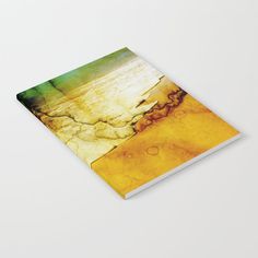 a book with an abstract painting on the front and back cover that is yellow, green, and brown