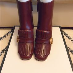 Authentic Brand New Gucci Leather Ankle Boots In Burgundy The Leather Ankle Boot With Double G Hardware Detail On Fold Over Fringe. Double G Fold Over Fringe Detail Side Zip Mid-Heel 5" Shaft Height, Based On A Size 37 3" Heel Made In Italy Gucci High Heel Boots For Fall, Gucci Pointed Toe Boots For Fall, Gucci Brown Boots For Fall, Gucci Luxury Boots For Fall, Gucci Brown Ankle Boots, Gucci Designer Ankle Boots, Designer Gucci Ankle Boots, Gucci Designer Leather Boots, Designer Gucci Leather Boots