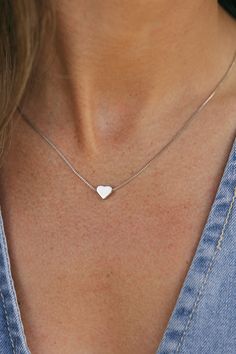 The most simple necklaces always make for the most memorable memories. Treat yourself or a loved one to our Simple Heart Necklace. This necklace features a silver heart, a dainty chain, secure clasp and a sterling sliver material so you know this necklace will last you past February! Length: 18" Simple Heart Necklace-Sterling Silver, boutique clothing, casual, the perfect necklace! Boutique Clothing Simple Silver Necklace Aesthetic, Dainty Silver Jewelry Aesthetic, Cute Silver Necklaces, Silver Chains For Women, Basic Necklace, Simple Heart Necklace, Stackable Necklaces, Silver Necklace Simple, Clothing Casual