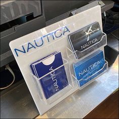 three different types of nautica are on display in a plastic case with the word nautica printed on it