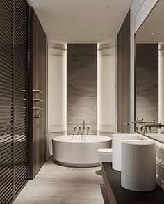 a large bathroom with two sinks and a bathtub in it's center area