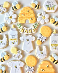 baby shower cookies are arranged in the shape of honeybees and bee combs