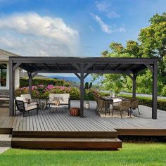 a deck with chairs and tables on it next to a large patio covered in flowers