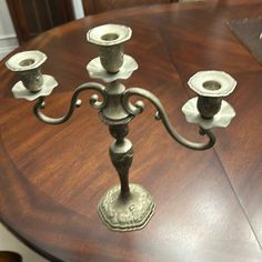 an ornate candelabra on a wooden table