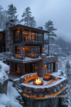 a house with a fire pit in the middle of it and snow on the ground