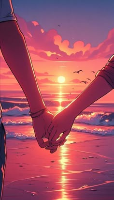 two people holding hands on the beach at sunset