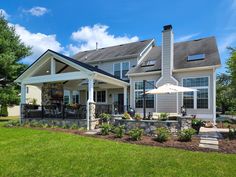 a large house with an umbrella in the front yard