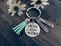 the best mom ever keychain has three tassels on it