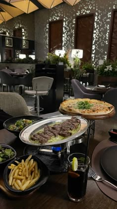 a table topped with plates filled with food