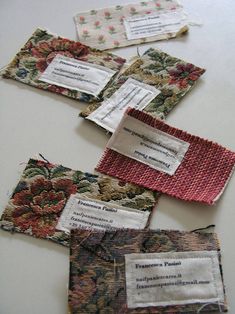 four pieces of fabric with tags attached to them