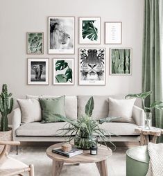 a living room filled with furniture and pictures on the wall