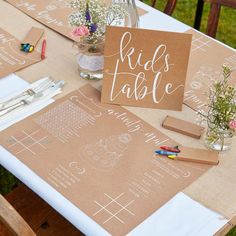 a table set up with place cards and napkins for guests to use on their wedding day