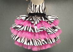 a zebra print dress with pink and black tulle