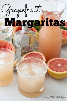 grapefruit margaritas in glasses with grapefruit garnish on the side