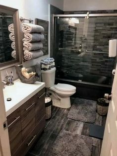 a bathroom with black and white tile flooring