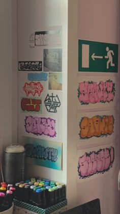 there are many stickers on the wall in this room