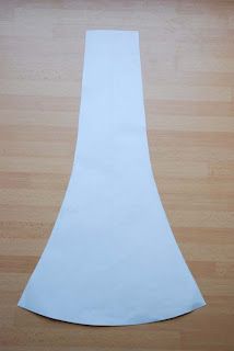 a piece of white paper sitting on top of a wooden floor