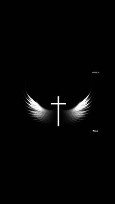 the cross with angel wings is in the dark