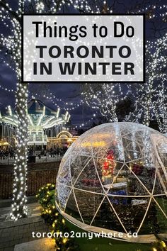 an inflatable dome with lights and trees around it that says things to do toronto in winter