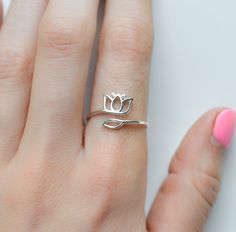 "Bring the beauty of nature to your jewelry collection with our sterling silver lotus ring! Featuring a delicate and dainty lotus flower design, this simple adjustable ring is perfect for adding a touch of elegance to any casual or formal outfit. Crafted with high-quality materials, our lotus flower ring is a must-have accessory for any nature-loving woman. Rings are sold in sizes 5 6 7 8 9 10 PRODUCT DETAILS * Ring is solid 925 sterling silver * Width of band measures 2.5mm * Comes beautifully Casual Rings Silver, Lotus Flower Ring, Lotus Ring, Lotus Flower Design, Casual Rings, Nature Ring, Detailed Ring, Gold Ring Stack, Open Ring