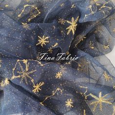 a blue and gold scarf with stars on it