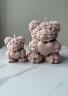 Introducing the "Heartfelt Bear" Candle by Lumière Petals, a charming and romantic addition to any space. 🐻❤️ Available in two sizes, big and small, this candle captures the essence of love and warmth. The price listed is for the big one, and the small one comes at a different cost. Each candle features an adorable bear holding a heart, meticulously crafted to convey tenderness and affection. Made with soy wax, it promises a clean, even burn, filling your home with a soft, enchanting glow.  Perfect for romantic occasions or as a heartfelt gift, the "Heartfelt Bear" Candle is a symbol of love that will melt hearts and create unforgettable moments. ✨ Illuminate your space with love and let the "Heartfelt Bear" Candle by Lumière Petals bring a touch of romance and charm to your life. DM for Wedding Favours Unique, Teddy Bear Candle, Candle Luxury, Candle Flower, Flower Bear, Bear Candle, Baby Shower Candles, Holding A Heart, Custom Candle