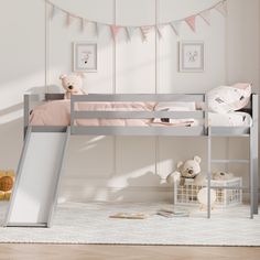 there is a bunk bed with a slide on the bottom and a teddy bear next to it