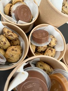 several cups filled with cookies and chocolate chips