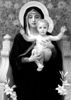 the virgin mary holding a child in her arms