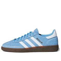 The adidas Handball Spezial 'Light Blue' is a stylish sneaker designed for handball players in 1979. It features a blue suede upper with decorative details on the sides and heel. The classic sneaker is also adorned with festive colors and the iconic four-leaf clover logo, celebrating St. Patrick's Day. The sneaker also features a pigskin suede upper, leather tongue, Spezial branding on the insoles, and an adidas logo on the heel. The rubber sole ensures comfort and durability, making this sneaker perfect for any handball enthusiast. (SNKR) Adidas Shoes Women Blue, Adidas Spezial Light Blue, Light Blue Sambas, Light Blue Sneakers, Light Blue Adidas, Clover Logo, Handball Players, Light Blue Shoes, Samba Shoes