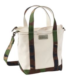 Introduced in 1944 as "Bean's Ice Carrier, " the beloved Boat and Tote is still crafted in Maine, one tote at a time. This 80th anniversary edition celebrates its classic style, legendary durability and the adventures to come. Spot clean. Zip-top closure. Adjustable, removable shoulder strap. Reinforced flat canvas bottom. Double-layer base. Heavy-duty 24 oz. cotton canvas. Hanging pocket inside. Exclusive Boat and Tote® 80th Anniversary label. Handcrafted in Maine since 1944, one tote at a time Llbean Tote, Boat And Tote, Business Laptop Bag, 80th Anniversary, Backpacking Gear, Gear Bag, Crossbody Tote Bag, Crossbody Tote, Travel Tote