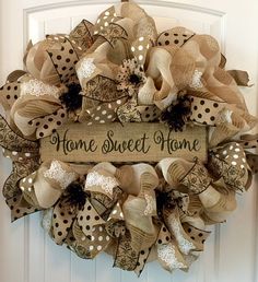 a wreath with the words home sweet home on it