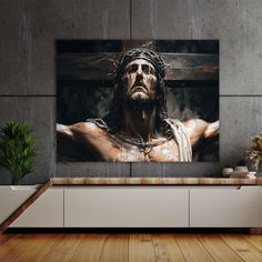 a painting of jesus christ on the cross in a room with wooden floors and walls