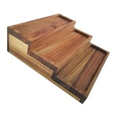 two wooden trays sitting on top of each other in front of a white background