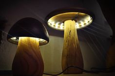 two wooden lamps sitting next to each other