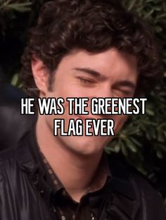 a man with curly hair wearing a black shirt and looking at the camera text reads he was the greenest flag ever